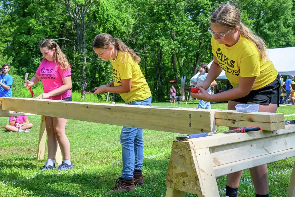 From left: Heather MacMillan, Brynn Dunbar and Maddyn Stanton hammer nails during the Construction Olympics, as part of the inaugural Construction Summer Camp, sponsored by the Northeast Construction Trades Workforce Coalition on Friday at Whitbeck Construction in Gansevoort. Photo Credit: Jim Franco/Times Union. View full gallery in original article here.